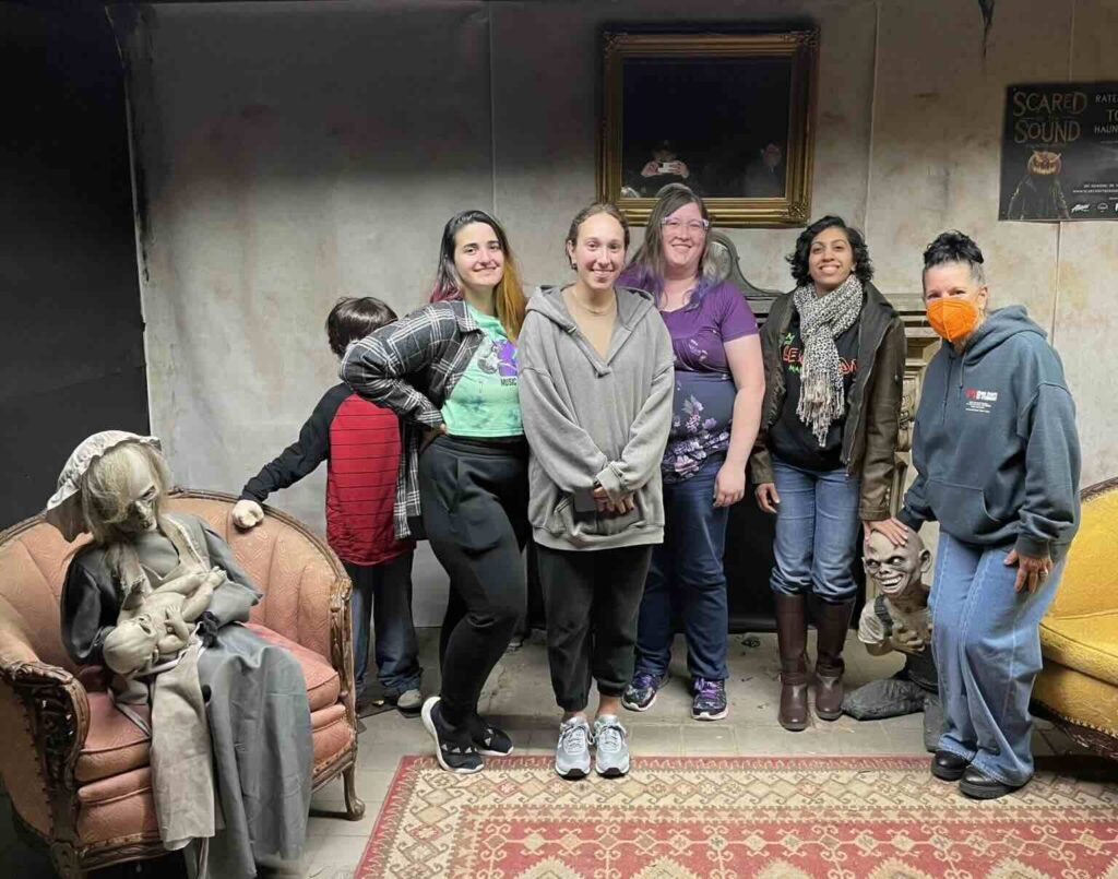 Group of veterinary staff and children at Halloween community event